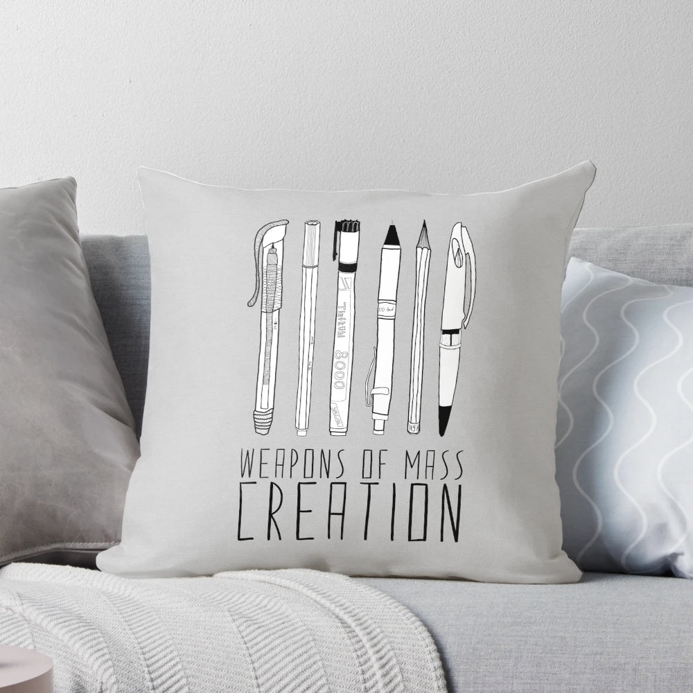 Weapons of Mass Creation Pillow, featuring a vibrant design of art supplies and tools for creative expression.