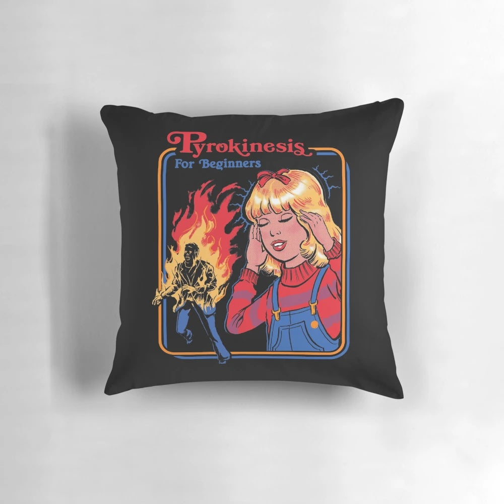 A vintage-style pillow featuring the title "Pyrokinesis for Beginners" with a fiery design.