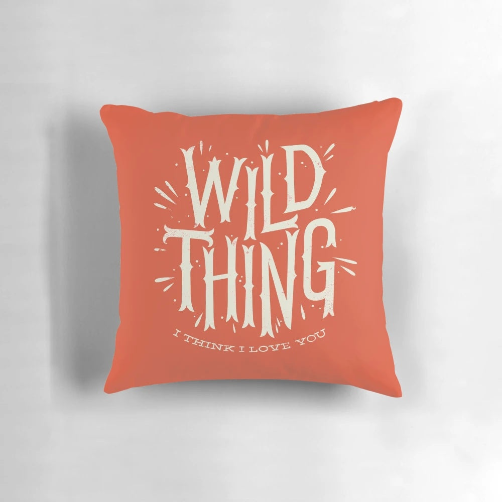 A vibrant, nature-inspired Wild Thing Pillow with a bold, typographic design