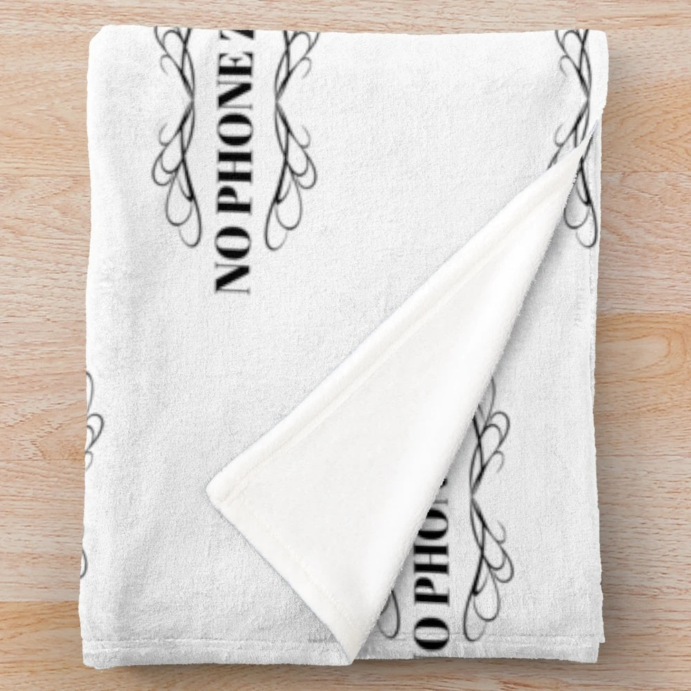 Cozy plush blanket with "NO PHONE ZONE" text, promoting a digital-free space