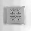 Pillow depicting the 6 stages of debugging in computer programming