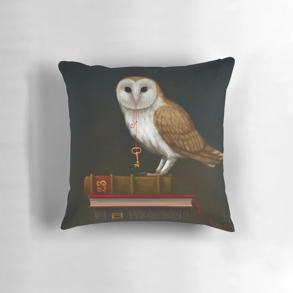Antique gold key and barn owl on a mystical pillow, symbolizing the key to knowledge and wisdom.