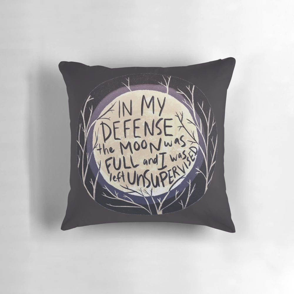 A decorative pillow featuring a full moon and the text "In my defense the moon was full and I was left unsupervised.