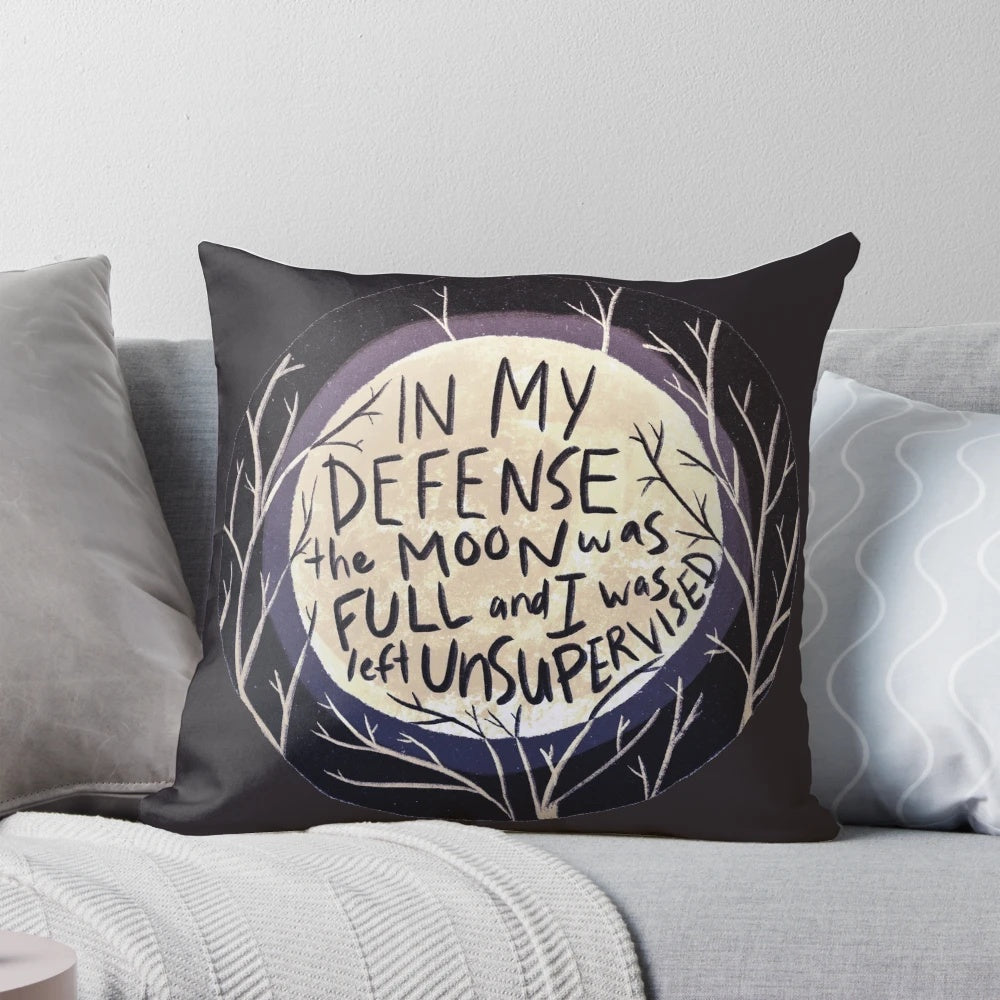 A decorative pillow featuring a full moon and the text "In my defense the moon was full and I was left unsupervised.