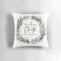 Pine wreath pillow with "Unto Us a Child is Born" bible verse text