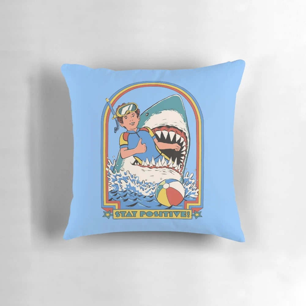 Decorative pillow with the text "Stay Positive" against a vibrant, retro-inspired background.