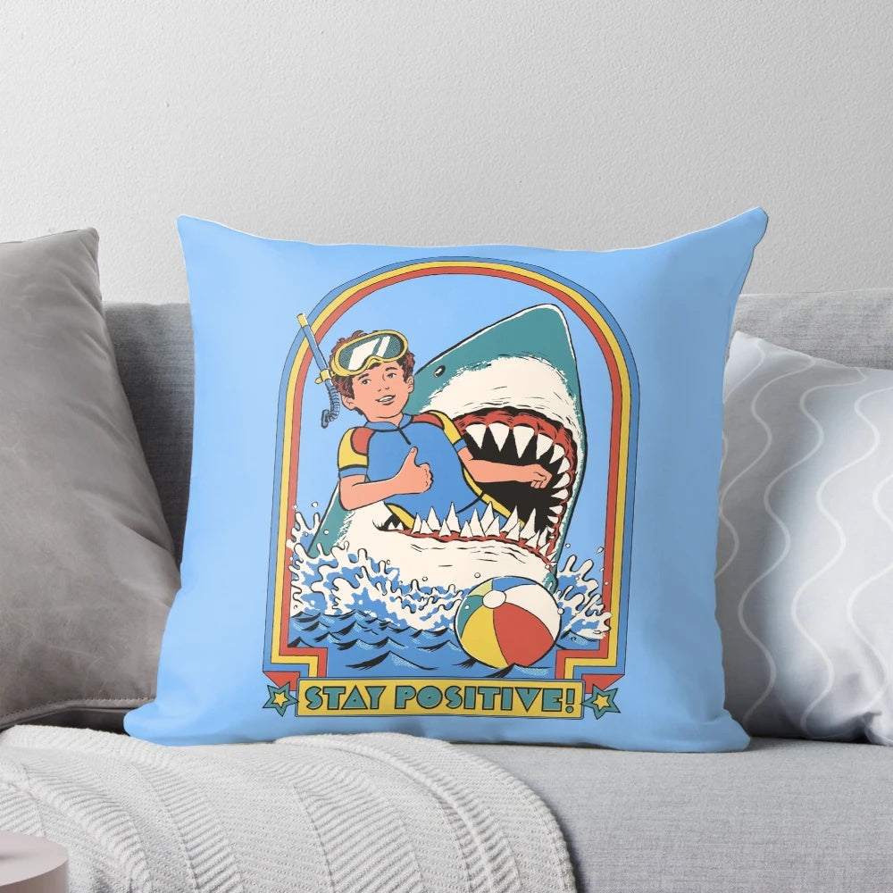Decorative pillow with the text "Stay Positive" against a vibrant, retro-inspired background.