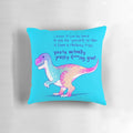 A vibrant, pastel-colored pillow featuring an illustrated t-rex dinosaur with an empowering message of self-acceptance and mental health.