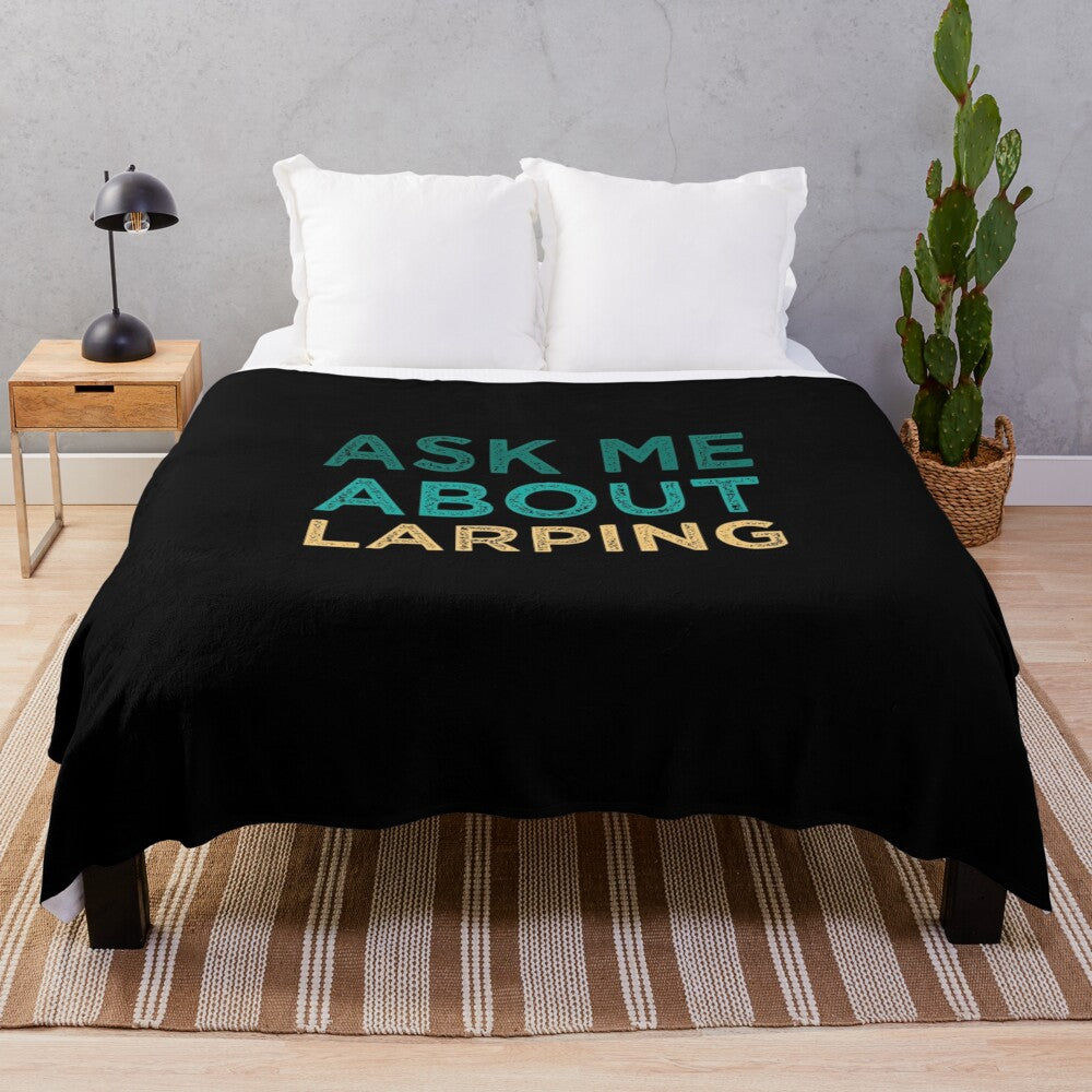 Plush blanket with "Ask Me About Larping" design