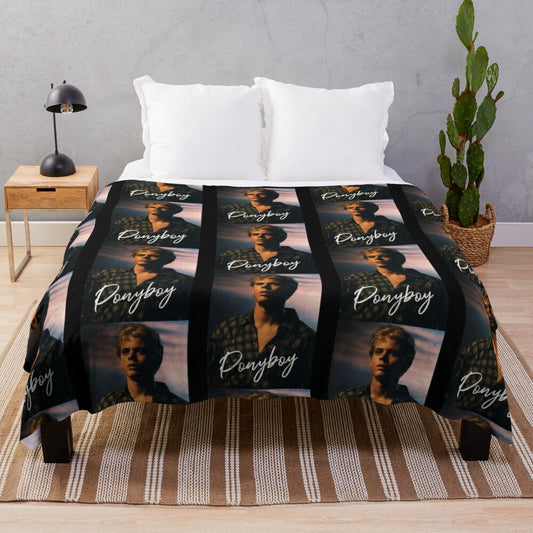 Ponyboy Curtis from the 80s movie "The Outsiders" printed on a plush blanket