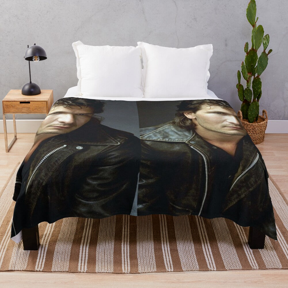 Vintage-inspired plush blanket featuring a portrait of actor Patrick Swayze