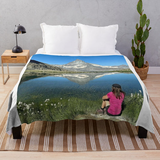 Cervin winter wonderland plush blanket featuring a serene landscape illustration