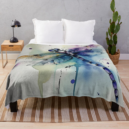 Watercolor dragonfly design on a cozy plush blanket