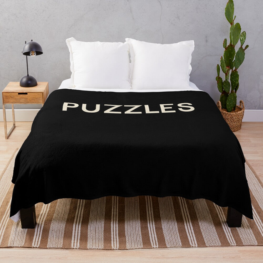 Plush blanket with hobbies and puzzles design