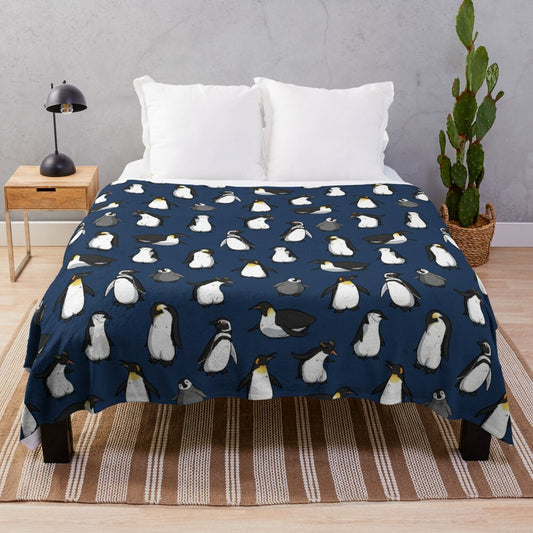 A cozy and cute plush blanket with a penguin pattern in dark blue