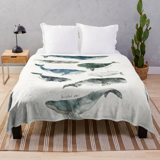 Whimsical watercolor whales design on a soft and cozy plush blanket