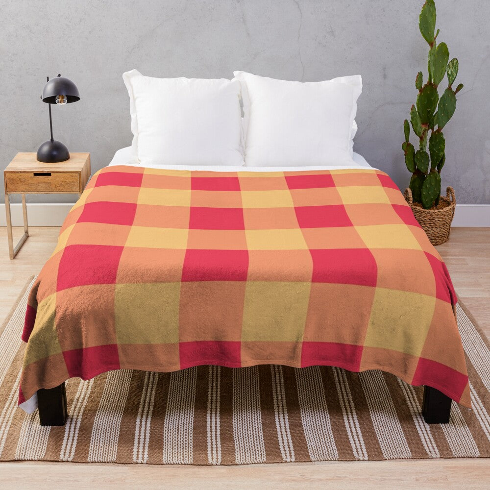 Soft, plush blanket with yellow and red plaid pattern, featuring an orchard watercolor design