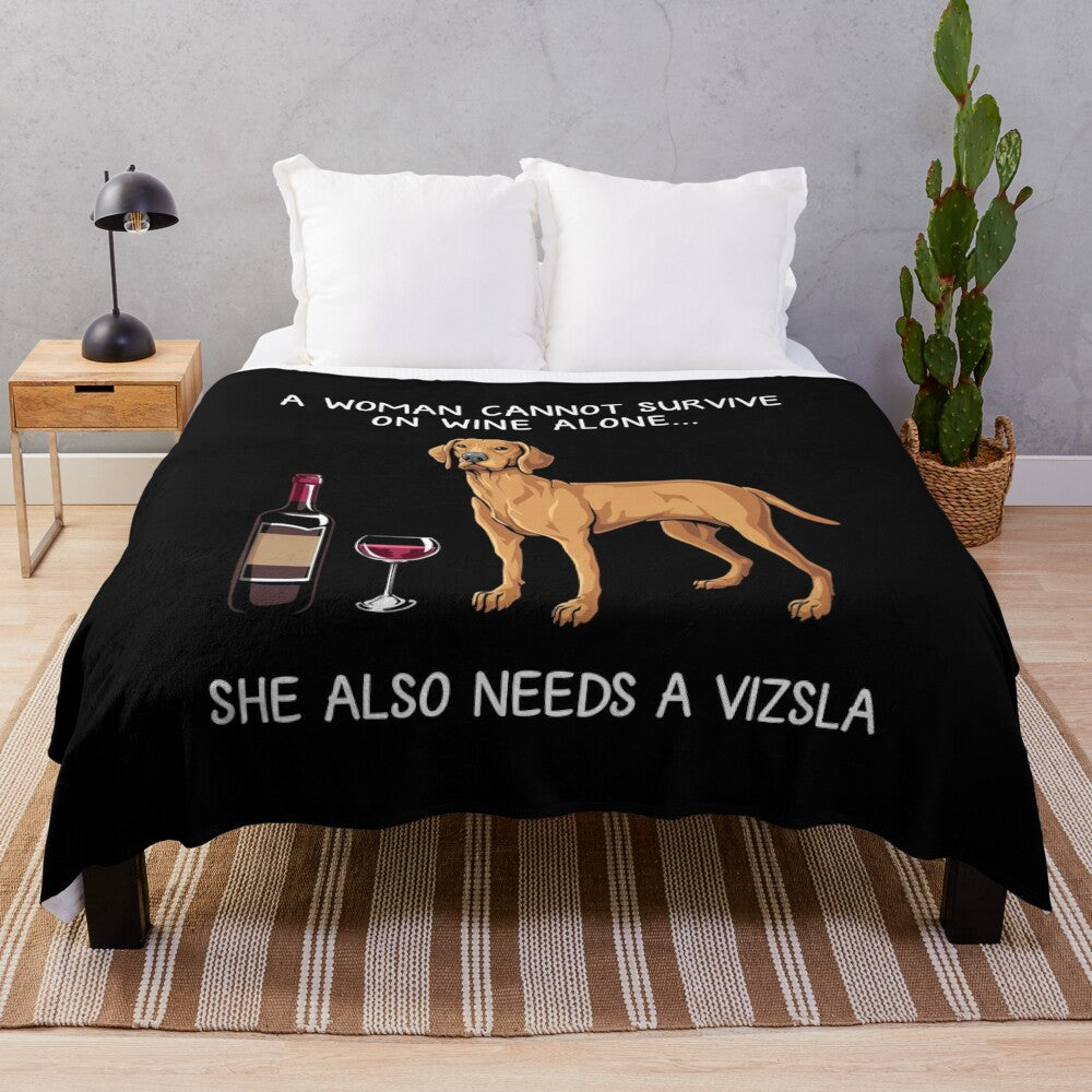 Vizsla dog in a plush blanket with a glass of wine