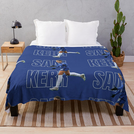 Blue plush blanket with graphic design inspired by Chelsea FC and Australian soccer player Sam Kerr