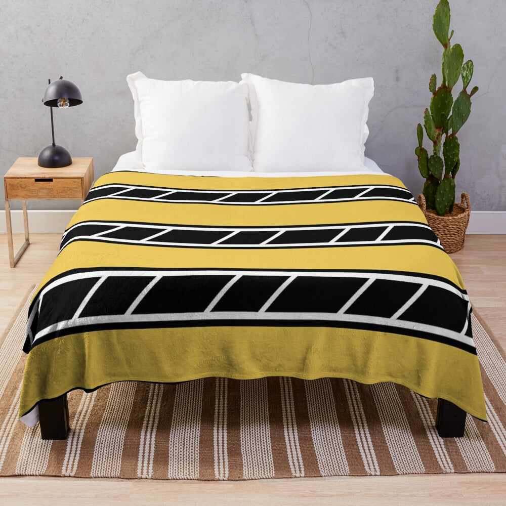 Retro-style plush blanket in black and yellow with classic motorcycle graphics