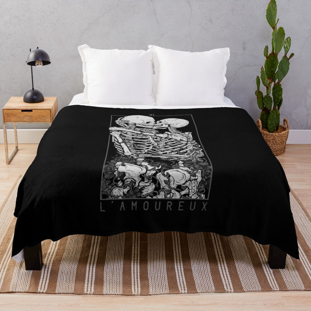 Plush blanket featuring a gothic romantic design with skulls, flowers, and a couple