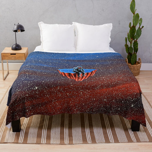 Disconnected plush blanket with space, astronaut, and cosmic design