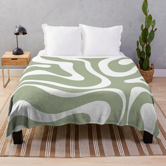 Plush blanket with abstract sage green and white minimalist pattern