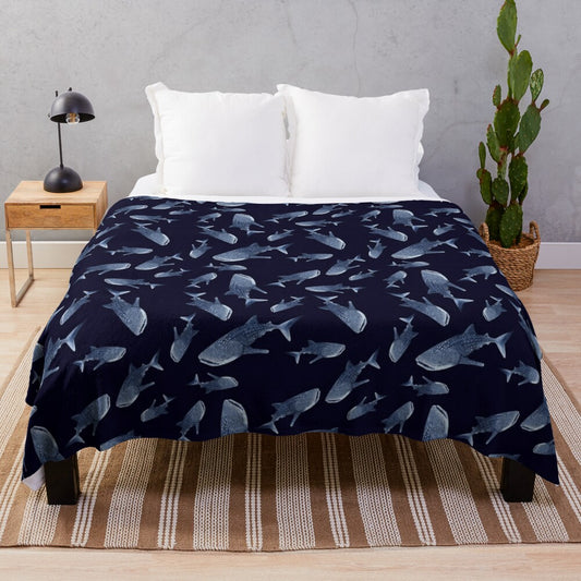 Navy blue plush blanket with a whale shark pattern design