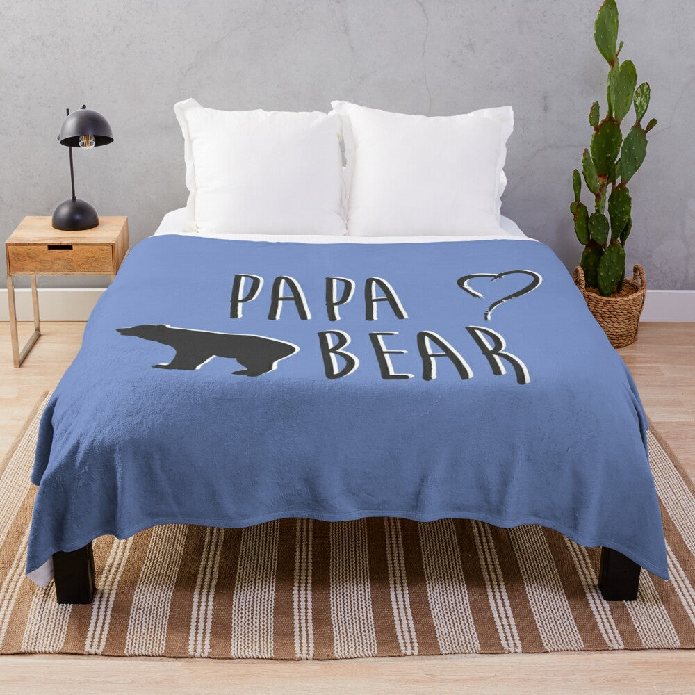 Soft and comfortable plush blanket featuring a papa bear design