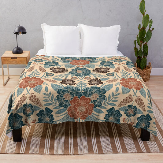 Soft and plush floral patterned blanket in shades of blue, brown, and rust