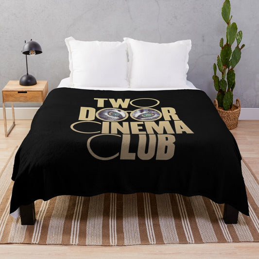 Colorful plush blanket featuring imagery and design inspired by the indie band Two Door Cinema Club