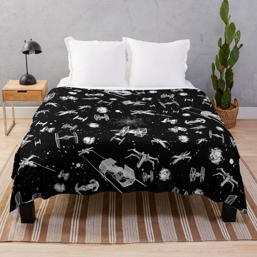 Plush blanket featuring a space battle scene with spaceships and stars