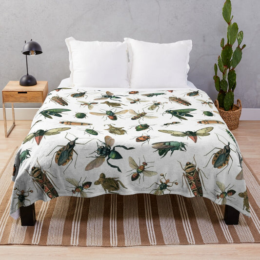 Colorful plush blanket featuring an illustrated pattern of various insects like beetles, ants, and bees