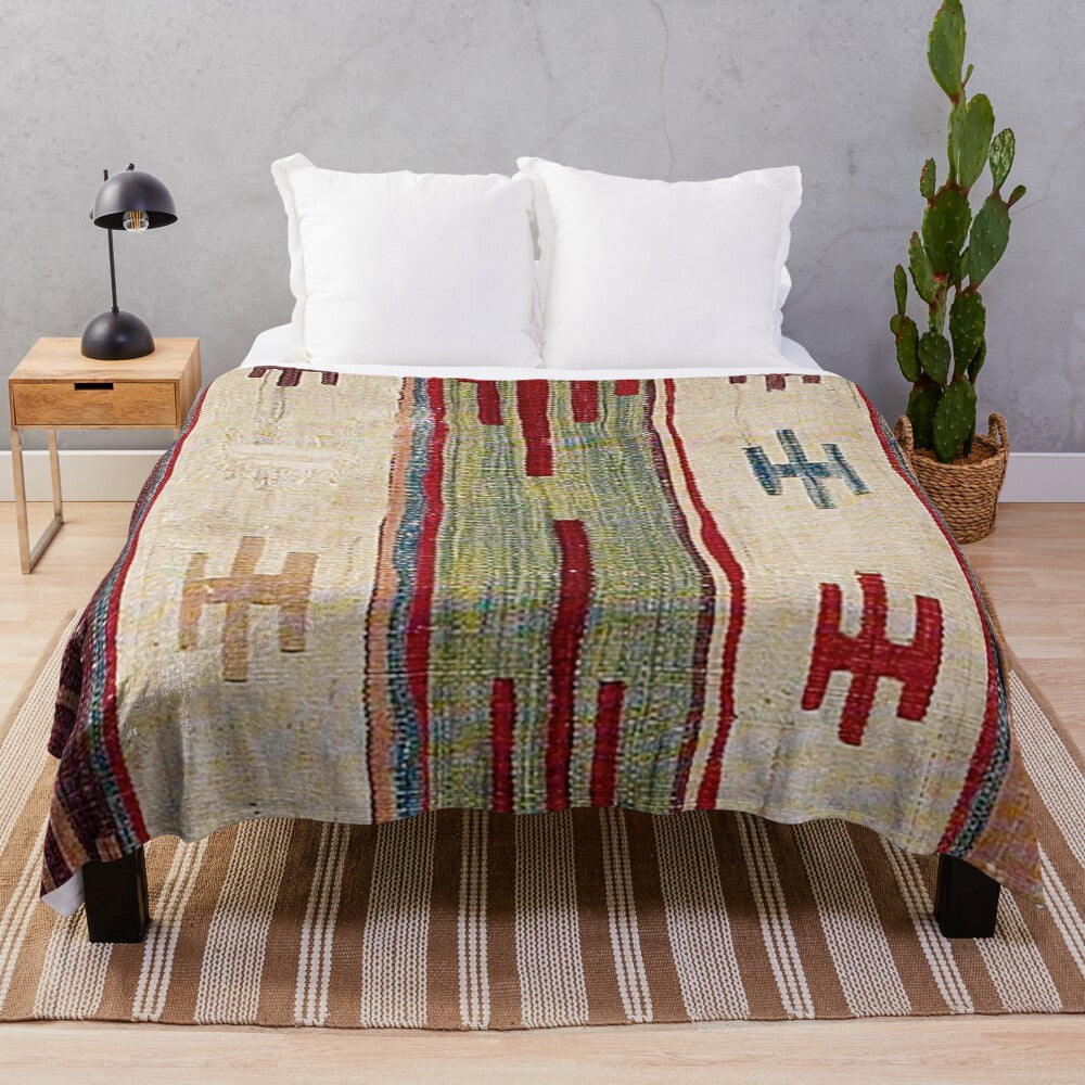 Colorful boho-inspired plush blanket with abstract, southwestern-style pattern