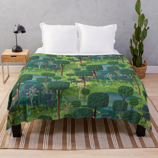 Emerald green plush blanket with fantasy landscape design