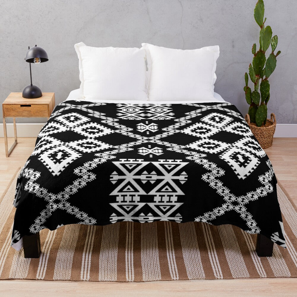 Monochrome geometric Aztec-inspired plush blanket