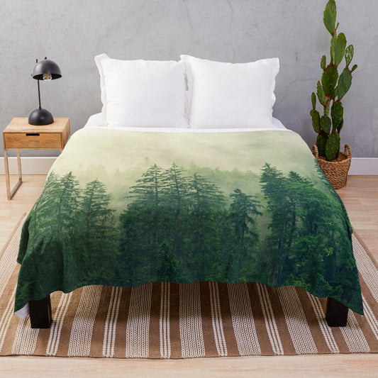 Soft, cozy plush blanket featuring a nature-inspired misty forest design