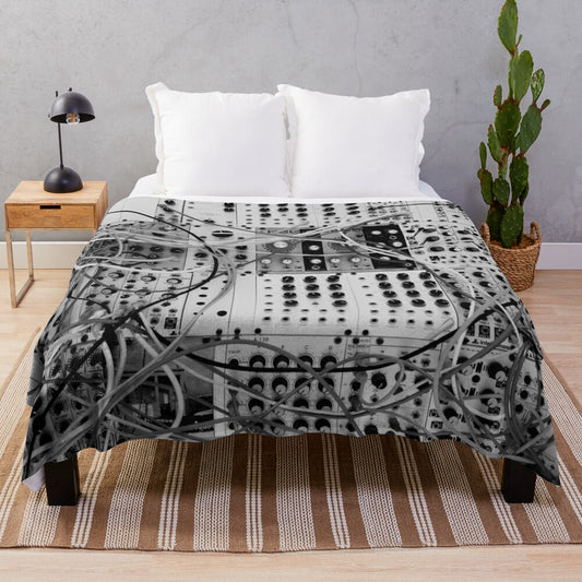 Plush blanket with analog synthesizer inspired modular design in black and white