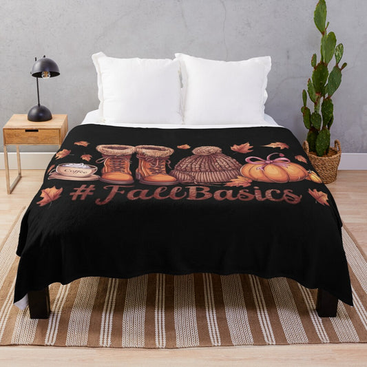 Autumn essentials plush blanket featuring fall elements like leaves, pumpkins, and warm drinks