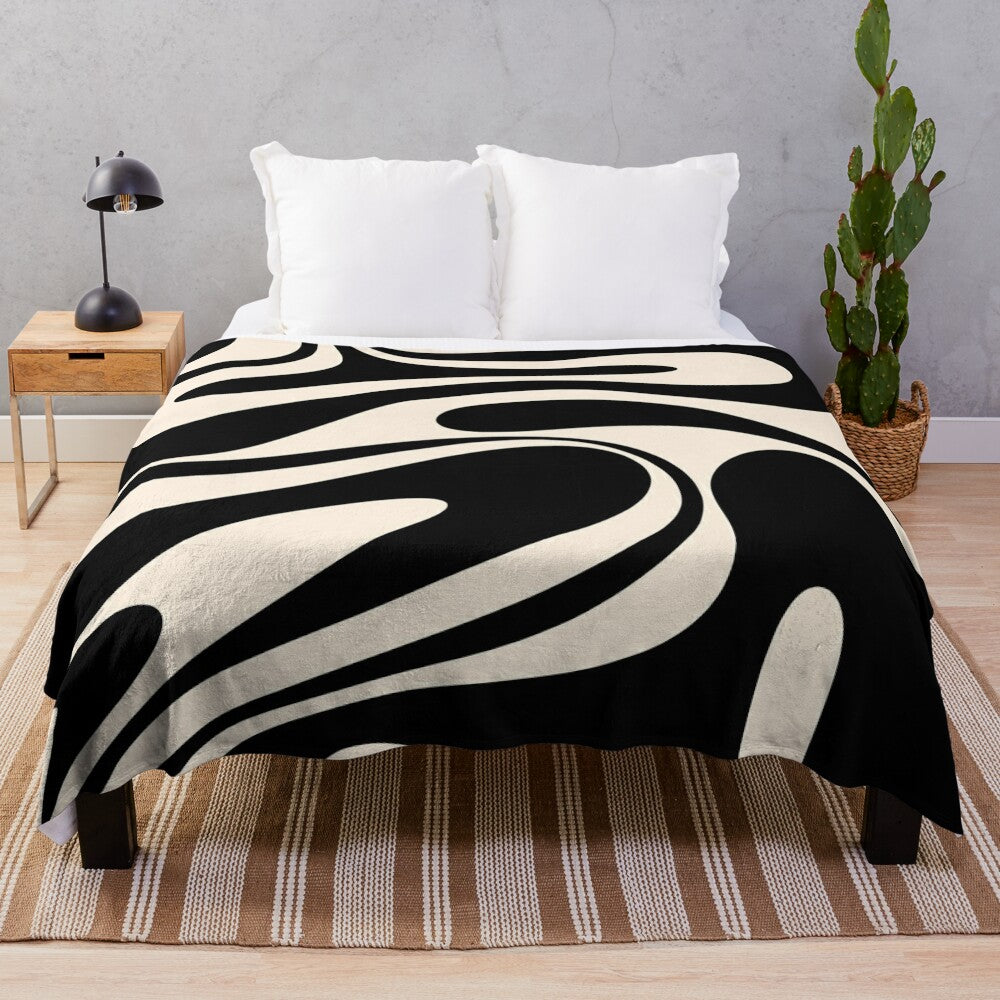 Retro abstract plush blanket in black and cream tones