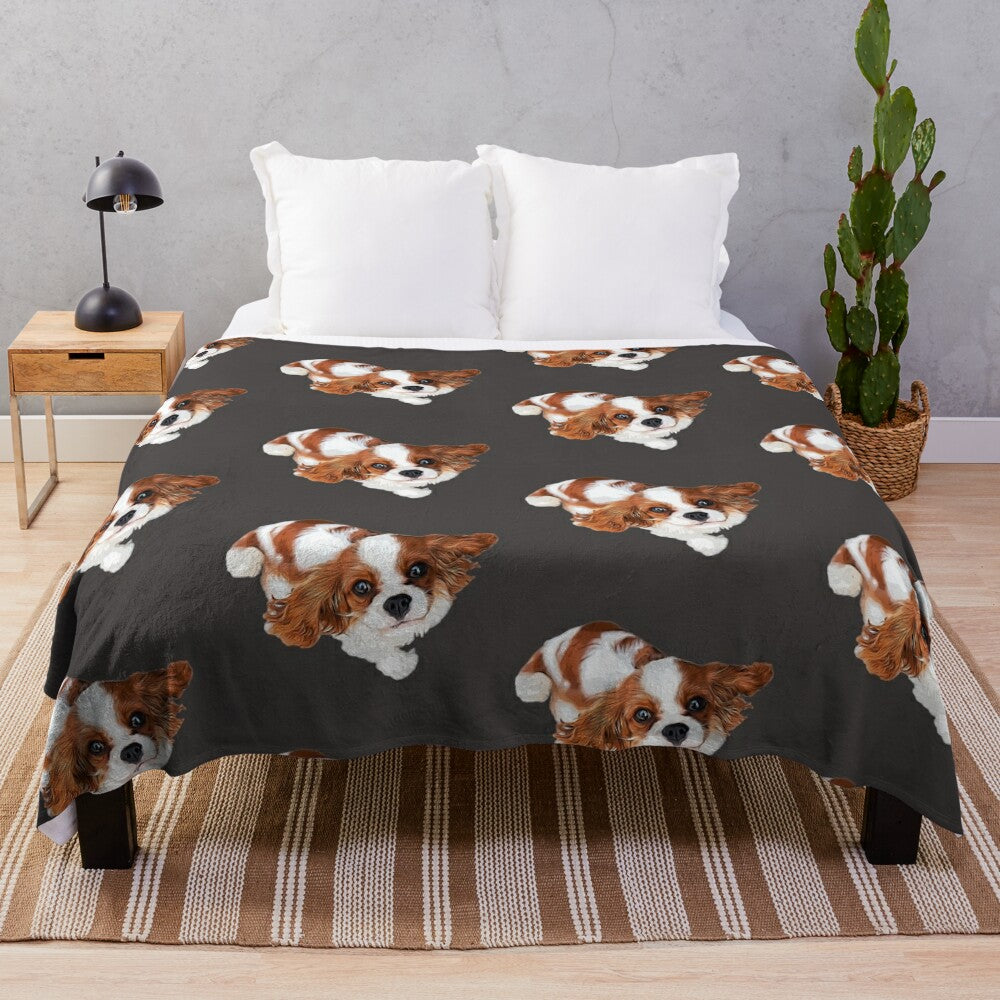 Cute Cavalier King Charles Spaniel puppy on a plush blanket