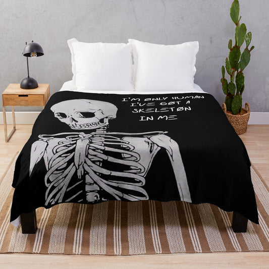 Dark and edgy plush blanket featuring a skeleton design with the text "I'm Only Human"