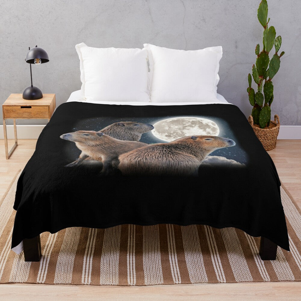 Adorable capybara characters sitting on a crescent moon against a starry night sky on a soft, cozy plush blanket