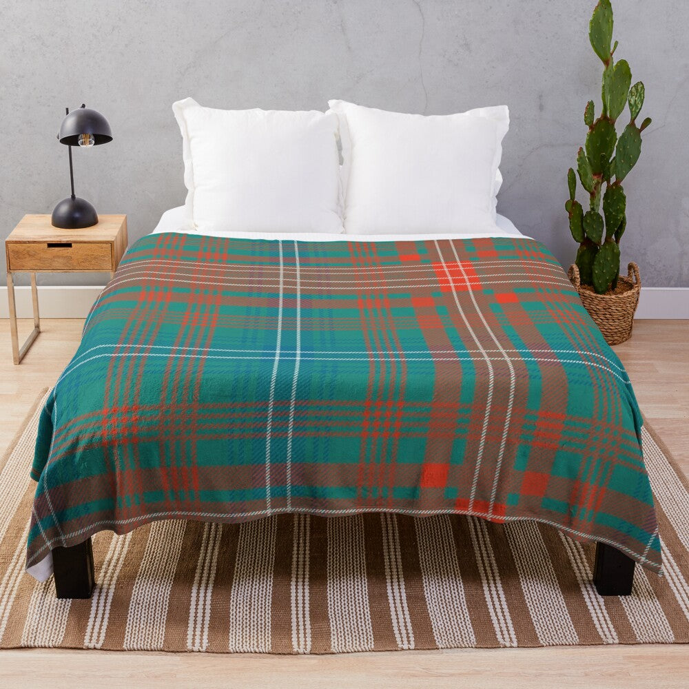 Tartan-style plaid plush blanket in green and blue colors