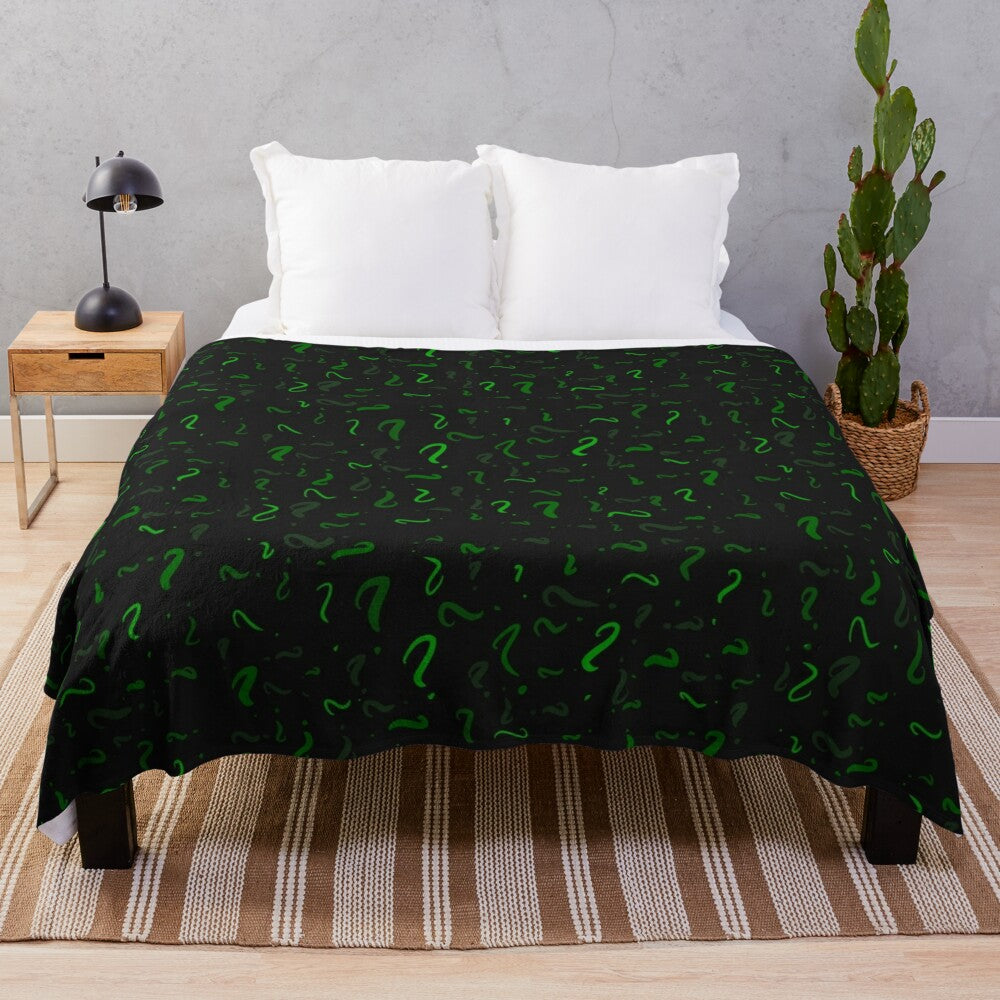 Plush blanket with a green and question mark pattern, perfect for DC Comics fans