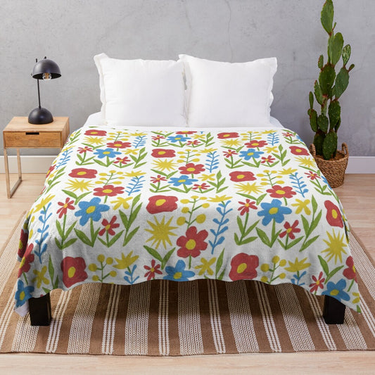 Colorful floral plush blanket featuring a pastel flower design