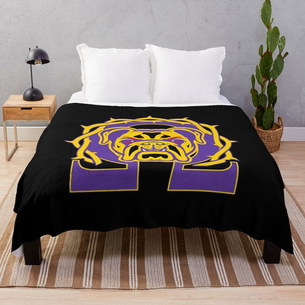 Omega Psi Phi fraternity plush blanket in purple and gold colors