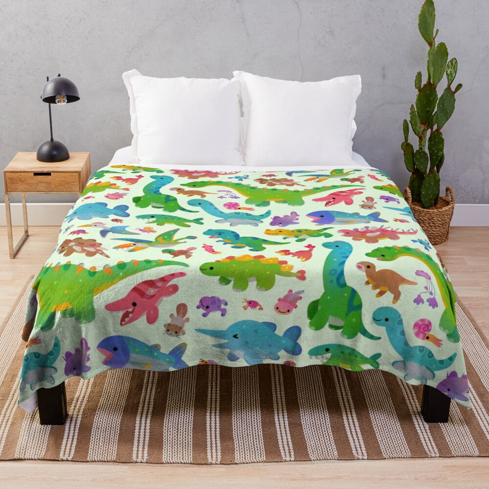 Pastel colored plush blanket with dinosaur design