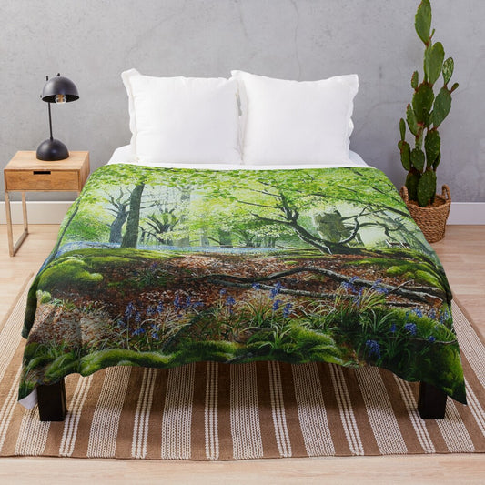 Soft and plush blue blanket with woodland and nature motifs