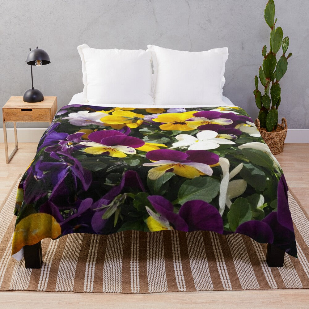 Soft and cozy plush blanket featuring a colorful design of winter pansies in spring